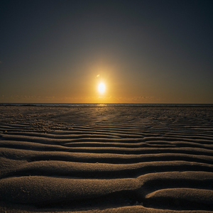 Image by xiSerge titled ’beach, sunrise, sand’. Source: Pixabay