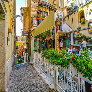 Image by user32212 titled ’taormina, sicily, cafe’. Source: Pixabay