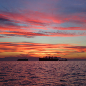 Image by papazachariasa titled ’sunset, ships, sea’. Source: Pixabay